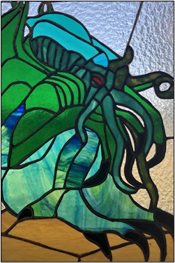 A stained glass rendition of HP Lovecraft’s Cthulhu, the logo for the Online Midwinter Seminar hosted at SWOSU.